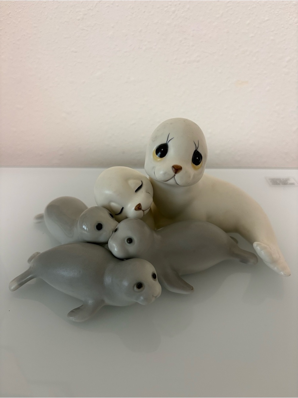 Antique White and Gray Ceramic Seal Family Figurine